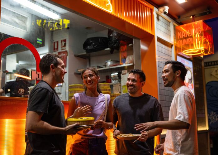 Four friends enjoy Chinatown Street Food and Stories Tour Haymarket with Local Sauce Tours, Haymarket