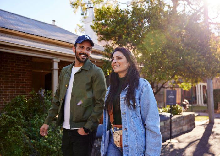 Couple walking through the streets of Camden, Camden, Sydney