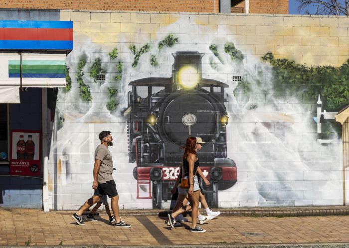 Family walking by mural, Loop-Line Pies, Thirlmere - Credit: Sharp Shots | Wollondilly Shire Council