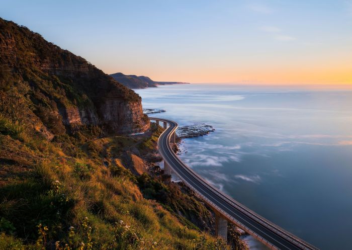 Sun rising over water, Sea Cliff Bridge, Clifton