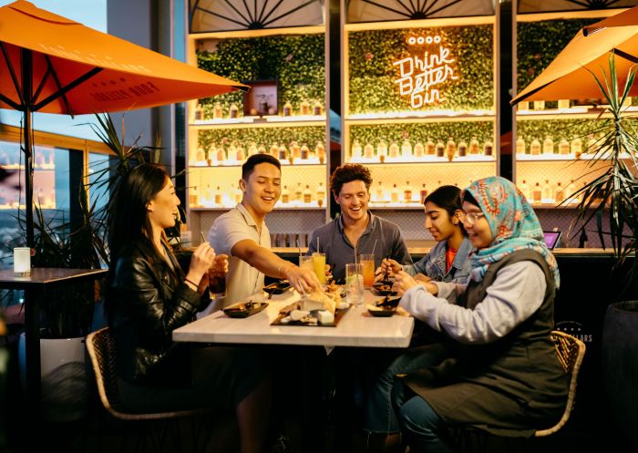 Young people enjoying drinks and food, Nick and Nora's, Parramatta