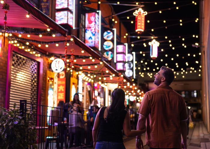 A couple enjoys the lights and delicious food, Burwood Chinatown, Burwood