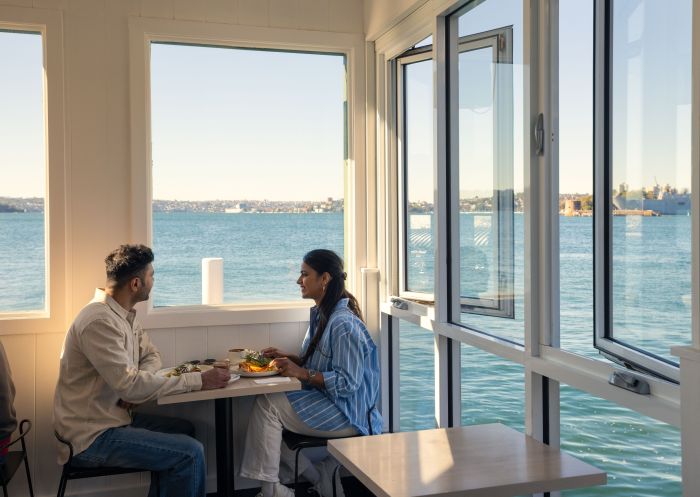 Couple having brunch with harbour view, Celsius Coffee, Kirribilli