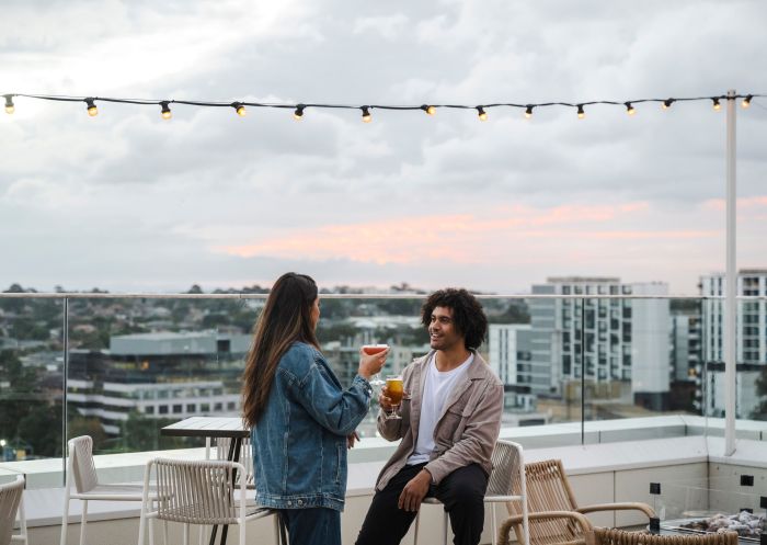 Couple enjoys a drink at rooftop bar, Lady Banks, Bankstown