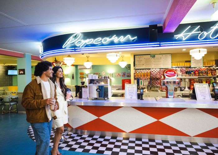 Couple visiting 50's inspired diner, Skyline Drive In Blacktown