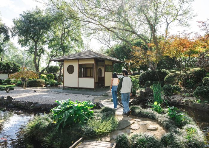 Couple visiting Japanese gardens, Campbelltown Arts Centre, Campbelltown