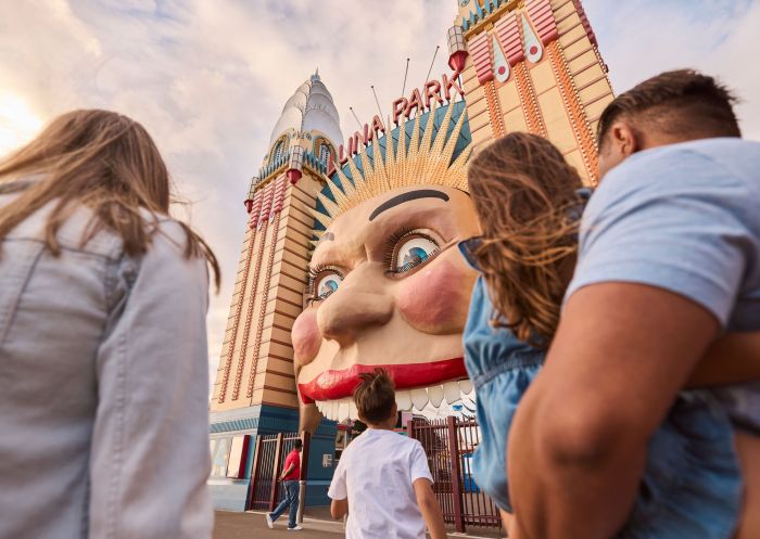 Family walking into the park, Luna Park Sydney, Milsons Point