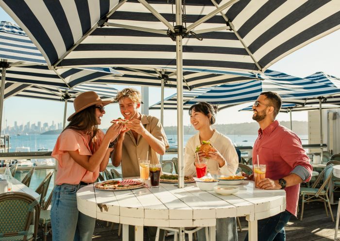 Young people enjoying food on a sunny day, Watsons Bay Hotel, Watsons Bay