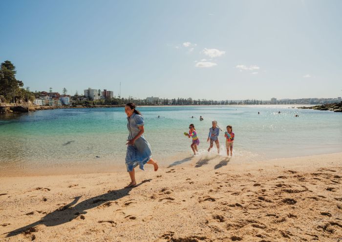 Family running on beach, Shelly Beach, Manly 