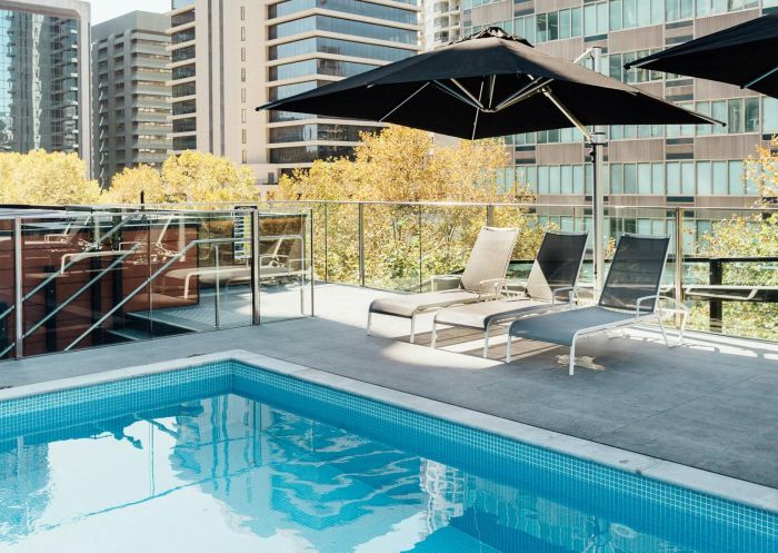 Deckchairs at rooftoop pool, Vibe Hotel North Syb - Credit: TFE NSW