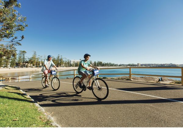 Cycling, Manly Beach Father and son enjoying a bike ride at Manly Beach
