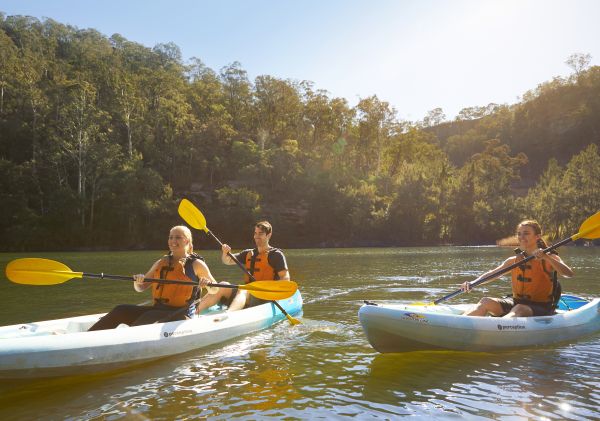 Friends kayaking along the Nepean River in Penrith, Sydney