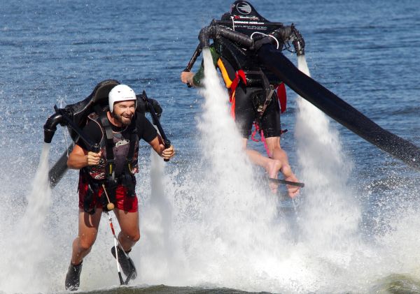 A jetpack-strapped man flying out of the water, Sydney International Regatta Centre