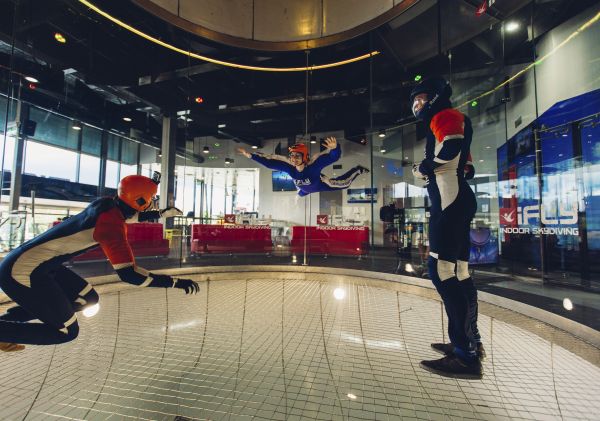 Woman enjoying an indoor skydiving experience at iFly Downunder, Penrith in Sydney's western suburbs.