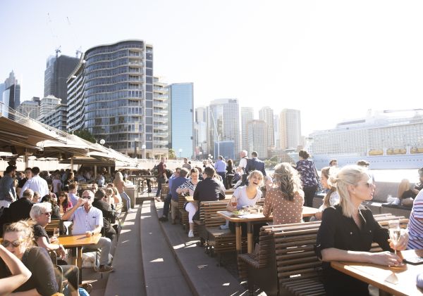 People enjoying food and drinks with a view at Opera Bar, Sydney Harbour