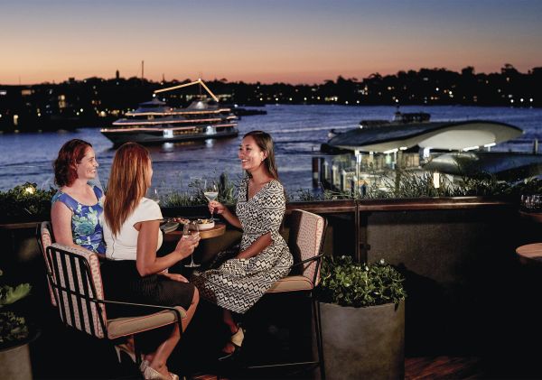 Patrons enjoying evening drinks at Smoke bar, Barangaroo House.