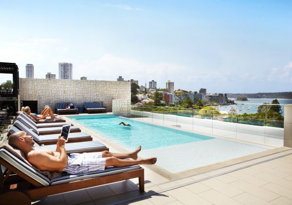 Guests relaxing by the rooftop pool at the Intercontinental Hotel in Double Bay, Sydney East