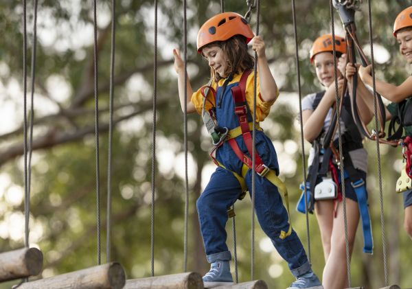 Young girl enjoying the action at TreeTops Adventure Park in Abbotsbury, Sydney West