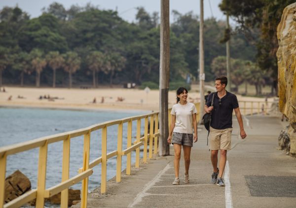 Couple enjoying a walk along Marine Parade, Manly