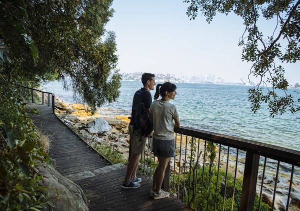 Couple enjoying scenic views across Sydney Harbour along the Hermitage Foreshore Walk, Vaucluse