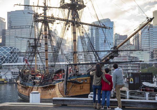 Family exploring the HMB Endeavour, an Australian-built replica of James Cook's ship on exhibit at the Australian National Maritime Museum, Darling Harbour.