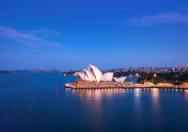 Sydney Opera House sails lit up for the evening in Sydney Harbour, Sydney