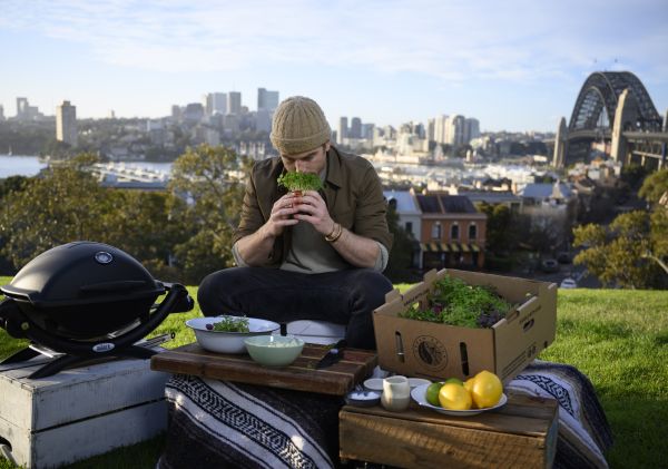 Hayden cooking Saltbush + Mountain Pepper Calamari with Micro Parsley Mayonnaise in Sydney Harbour	