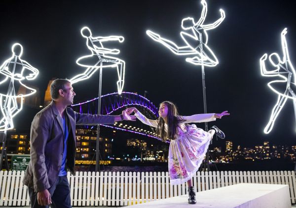 Father and daughter enjoying the Ballerina light installation in Campbells Cove, The Rocks during VIvid Sydney 2019