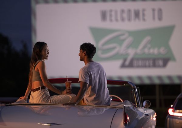 Couple sitting in their car ready to watch a movie at the Skyline Drive In Blacktown