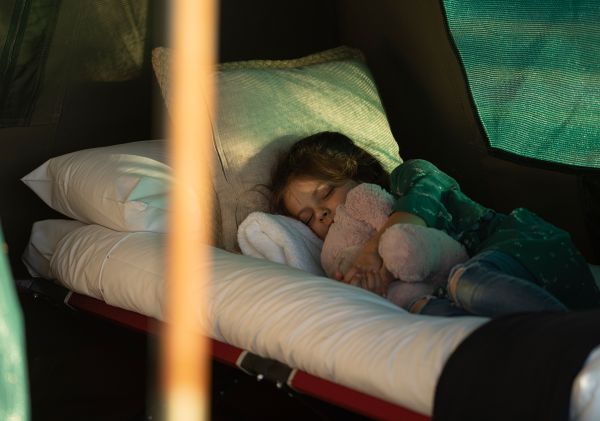 Child having an afternoon nap at waterfront campground, Cockatoo Island