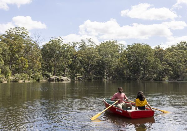 Couple enjoying a day out on Hunts Creek, Parramatta with Parramatta Rowboats