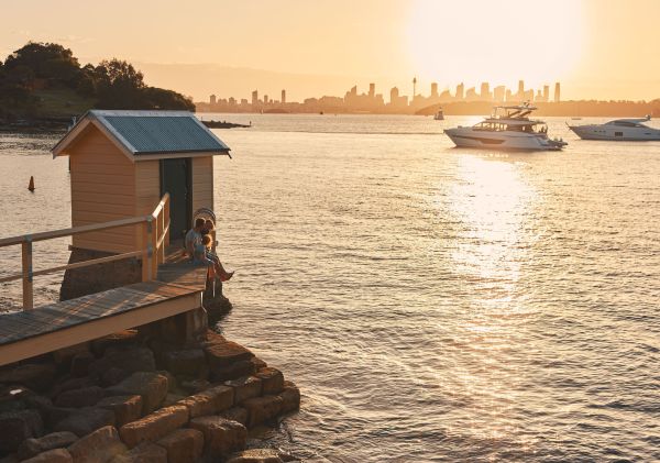 Family enjoying some food on the jetty at Camp Cove, Watsons Bay