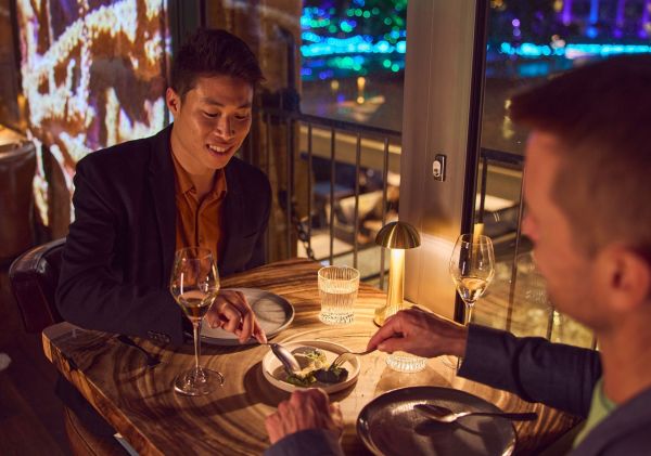 Couple enjoying a meal at 6HEAD Vivid Series Dinner, The Rocks