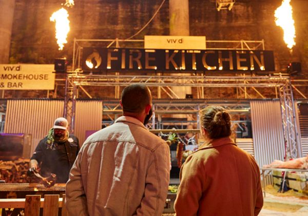 Couple view the smokehouse, Vivid Fire Kitchen