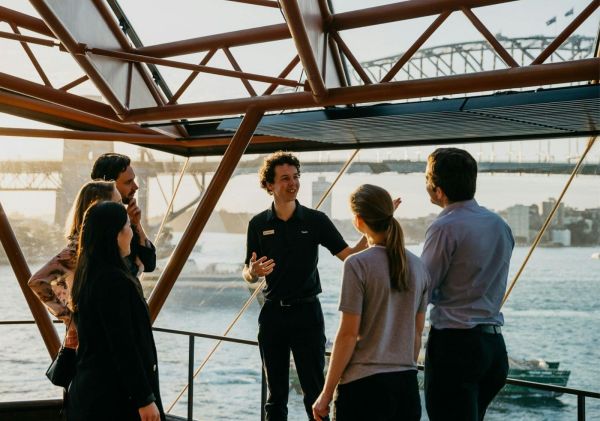 Tour guide showing group of people the Opera House, Sydney Opera House Tours. Sydney - Credit: Nikki To