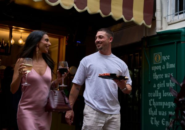Couple enjoying bar food, The Grand Electric, Redfern
