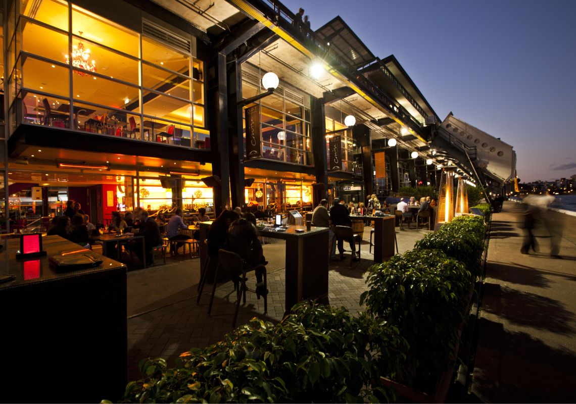 Overseas Passenger Terminal bars and restaurants at night featuring Cruise bar in foreground, The Rocks Overseas Passenger Terminal, Circular Quay