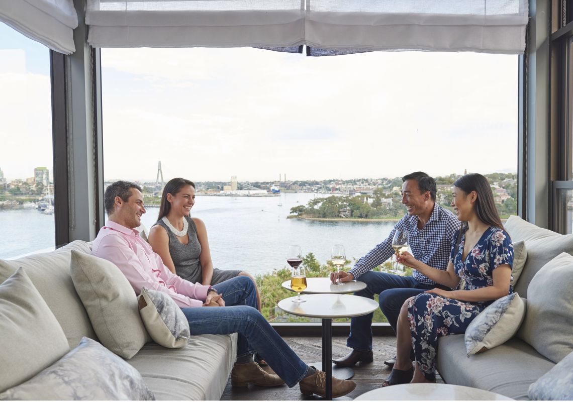 Couples enjoying drinks with Harbour views at Henry Deane cocktail lounge in Hotel Palisade Hotel Palisade, Millers Point