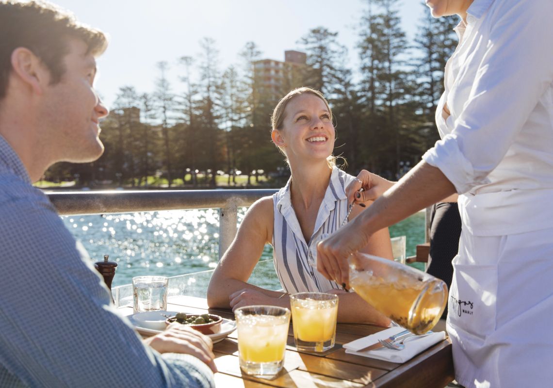Hugos Manly, on Manly Wharf Couple enjoying food and drinks at Hugos Manly at Manly Wharf