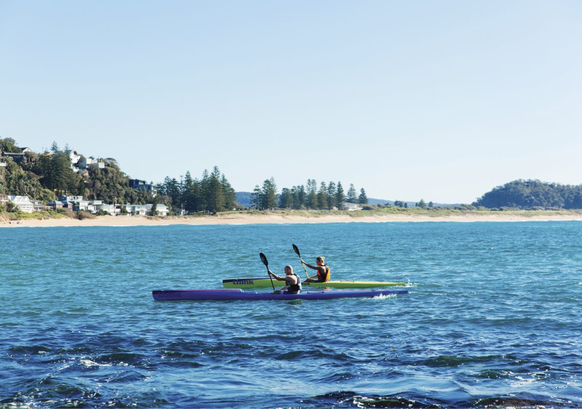 Palm Beach, Sydney Two kayakers paddling at Palm Beach, Sydney
