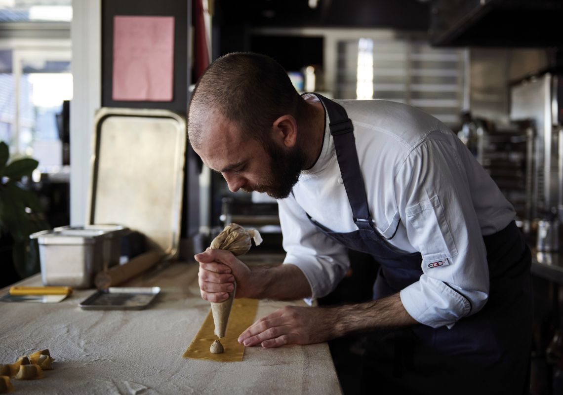 LuMi Dining, Pyrmont Chef preparing pasta at LuMi Dining, on a Pyrmont wharf