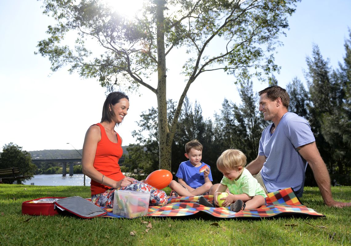 A family enjoys a picnic on the Nepean river, Penrith