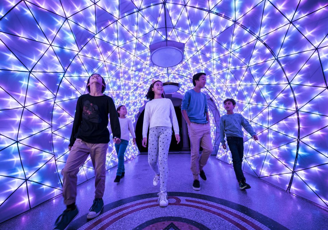 Vivid Sydney 2018, Taronga Zoo Children walking through the port jackson shark light installation at Taronga Zoo, Vivid Sydney 2018