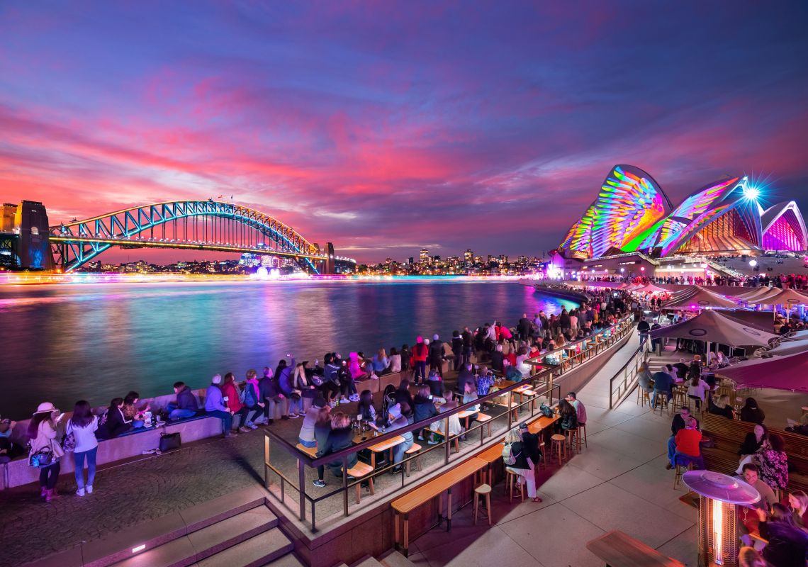 Vivid Sydney 2018, Circular Quay Patrons at Opera Bar enjoying the sunset and light projections during Vivid Sydney 2018
