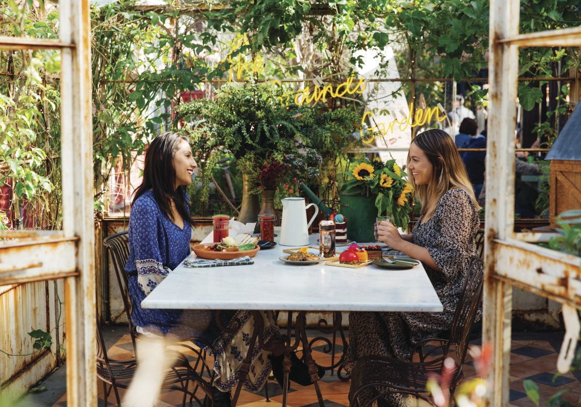 The Grounds of Alexandria, Alexandria Friends enjoying breakfast and morning tea at the Grounds of Alexandria in Alexandria, Sydney