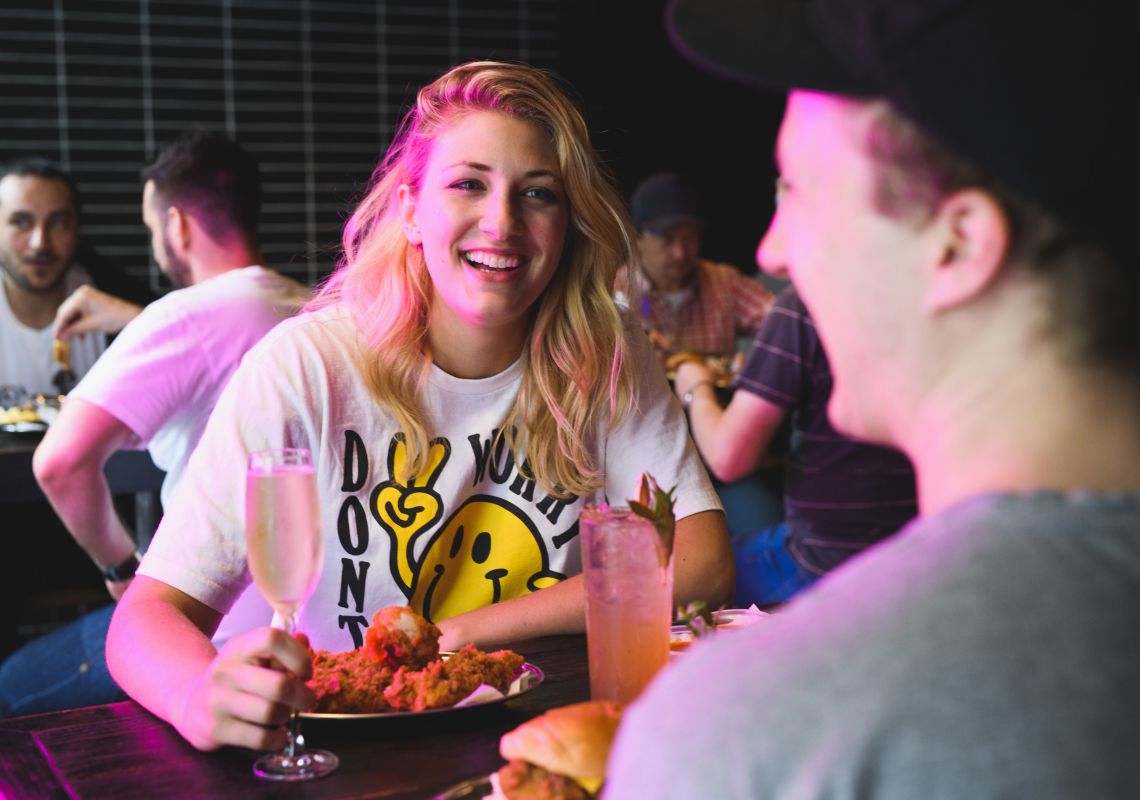 Butter, Surry Hills Couple enjoying friend chicken and drinks at Butter in Surry Hills