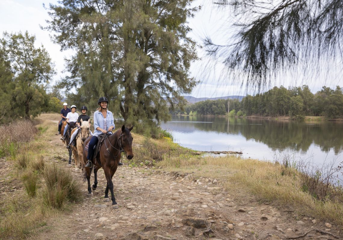 Hawkesbury Valley Equestrian Centre, Yarramundi Family enjoying a horseriding experience along the Hawkesbury River with Hawkesbury Valley Equestrian Centre