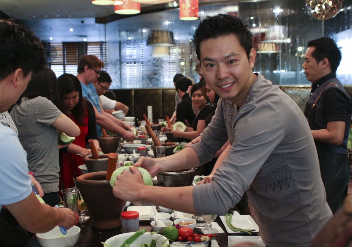 I Ate My Way Through, Surry Hills A man making his own Thai and Laos green papaya salads, I Ate My Way Through tour in Surry Hills