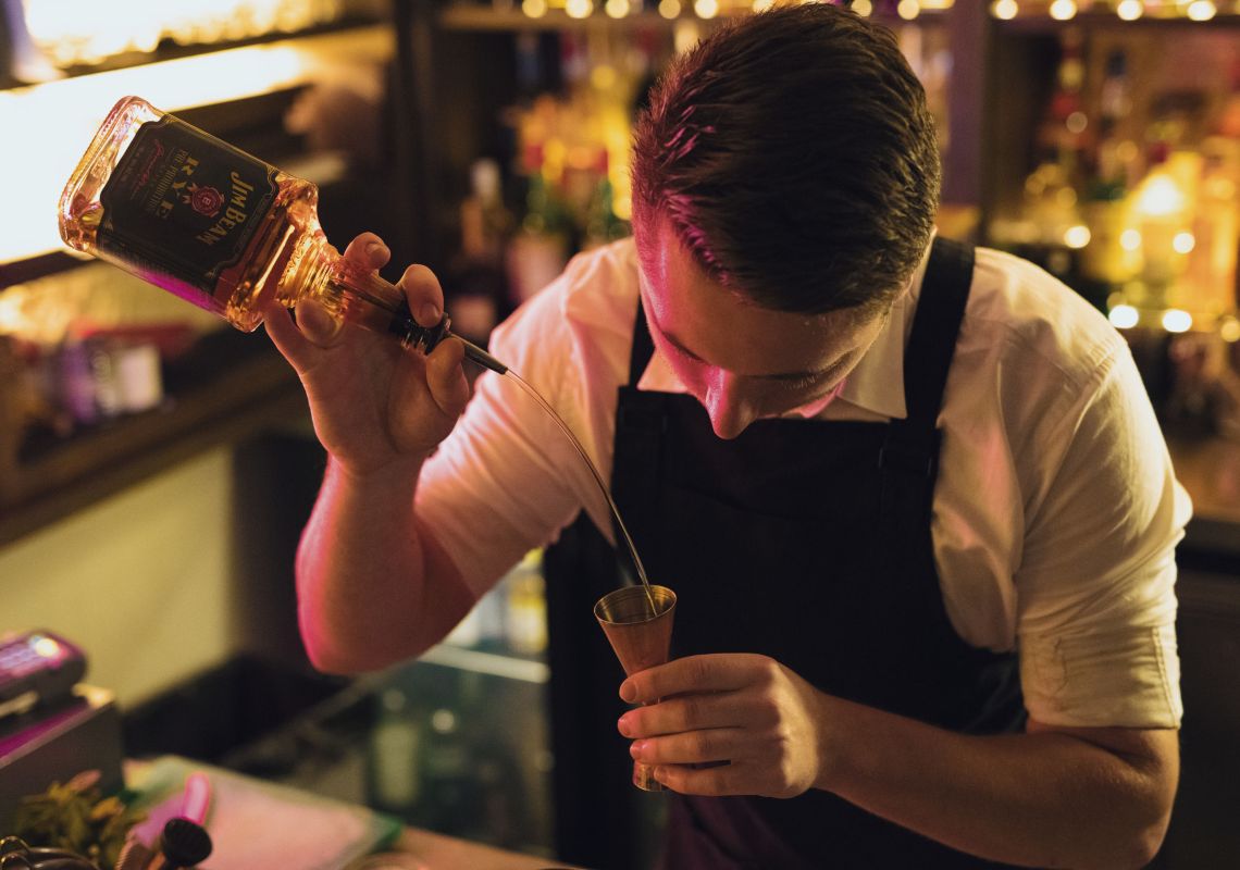 The Doss House bar, The Rocks Bartender creating a cocktail at The Doss House bar in The Rocks