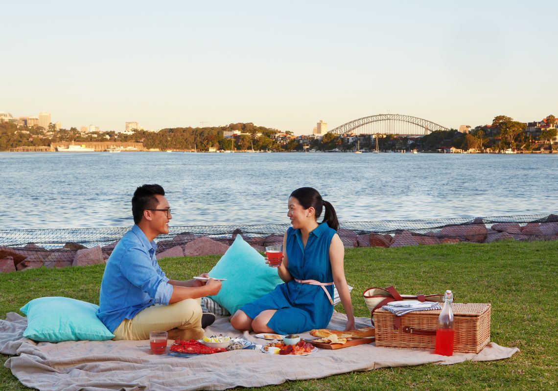 Cockatoo Island, Sydney City Couple having a picnic by the water on Cockatoo Island, Sydney